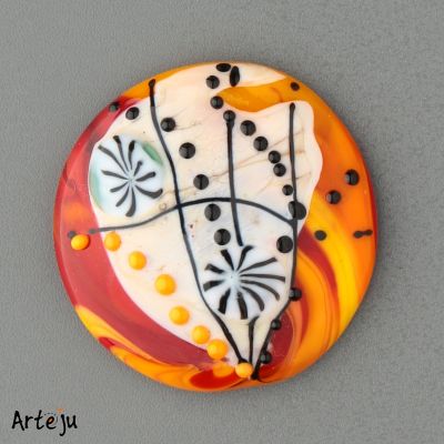 Glass Cabochon with shades of orange, yellow, red, cream and black