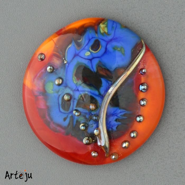 Glass Cabochon with shades of red, blue and orange